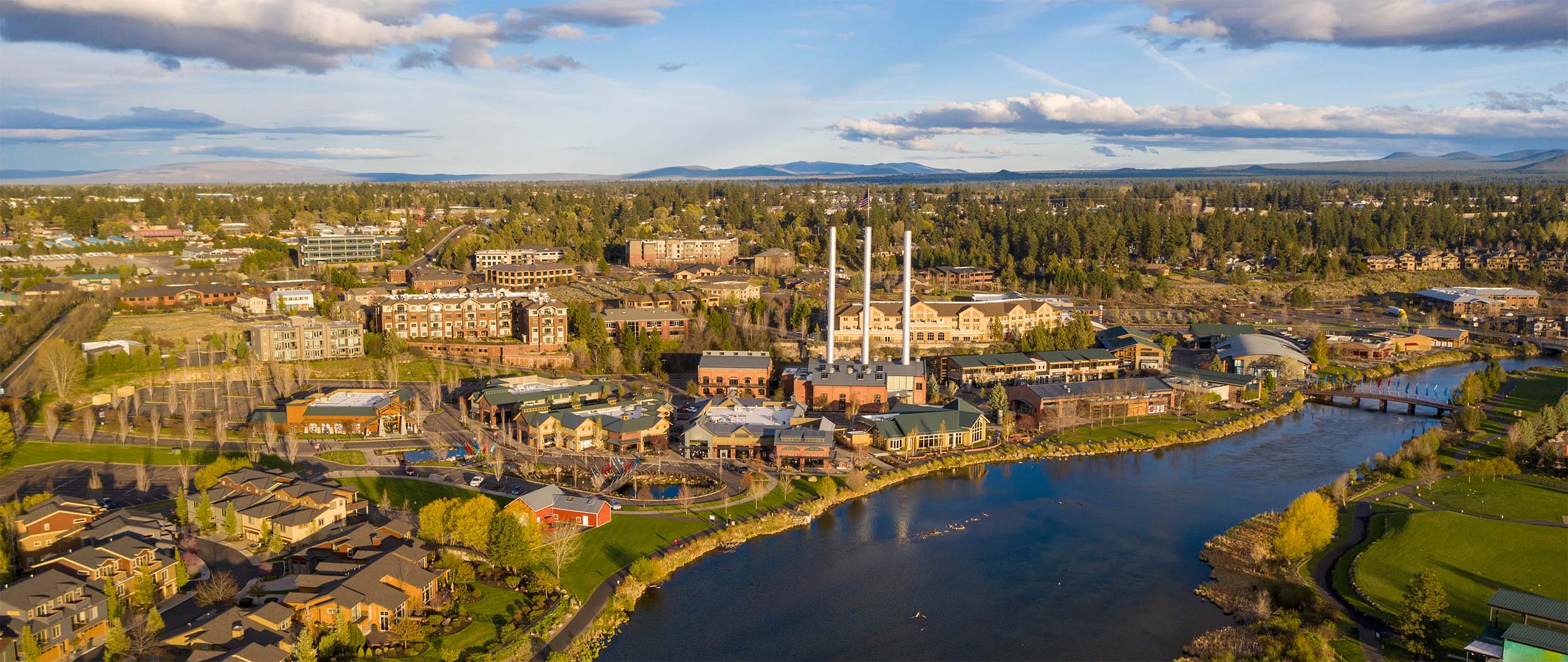 Aerial view of Bend's Old Mill District along the Deschutes River